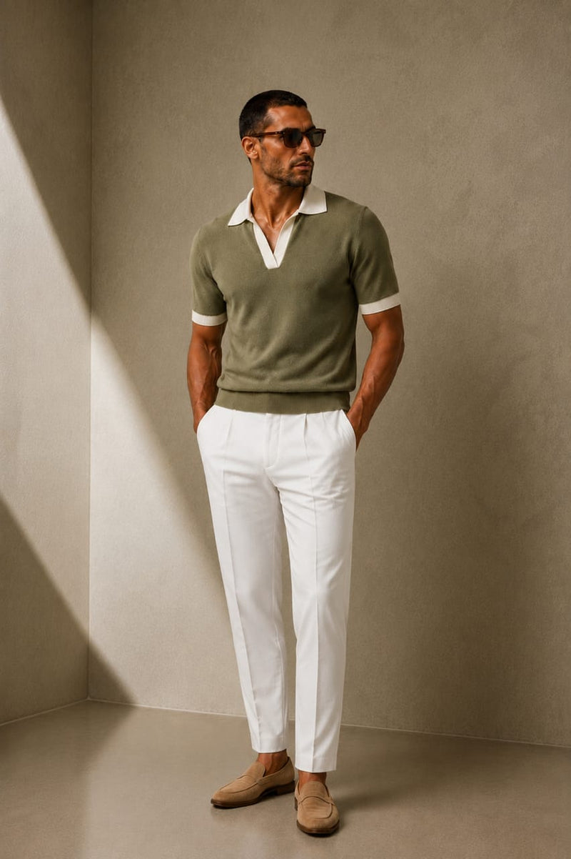 ARTLESS Riviera Polo in olive sage with contrasting ivory collar and cuffs, styled with white tailored trousers.