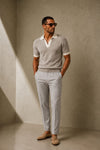 ARTLESS Riviera Polo in stone grey featuring an open V-neck, ivory collar and contrasting sleeve cuffs.