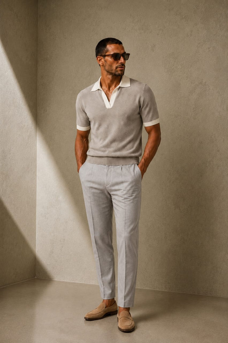 ARTLESS Riviera Polo in stone grey featuring an open V-neck, ivory collar and contrasting sleeve cuffs.